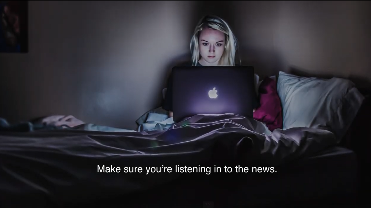 make sure you're listening in to the news. woman reading the news online at night